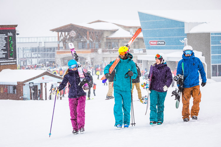 Friends going skiing in Whistler Village