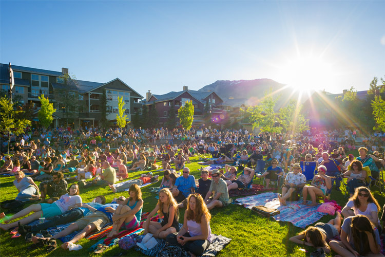 Evening in Whistler Olympic Plaza with audience watching a concert