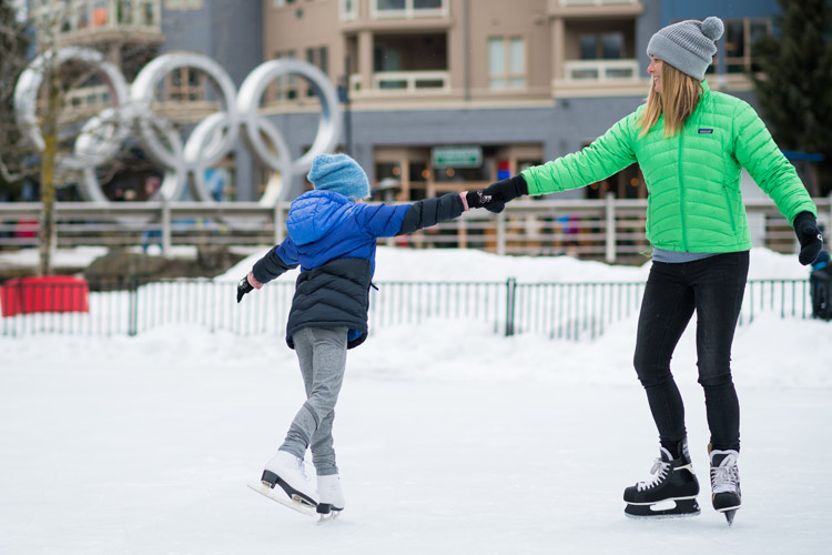 Family skating at Olympic Plaza